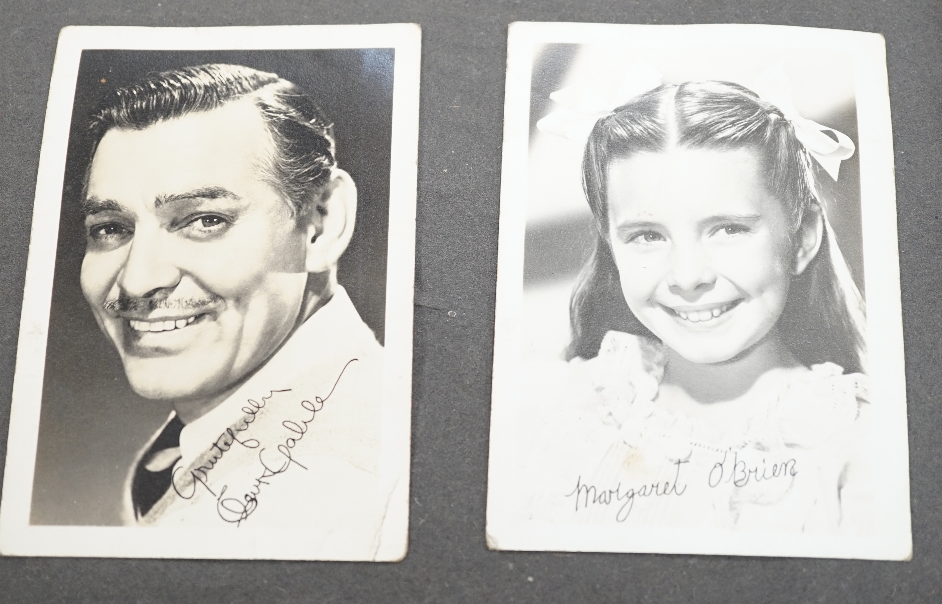 A vintage black and white photograph album with some autographs including Lucille Ball and Margaret O’Brien